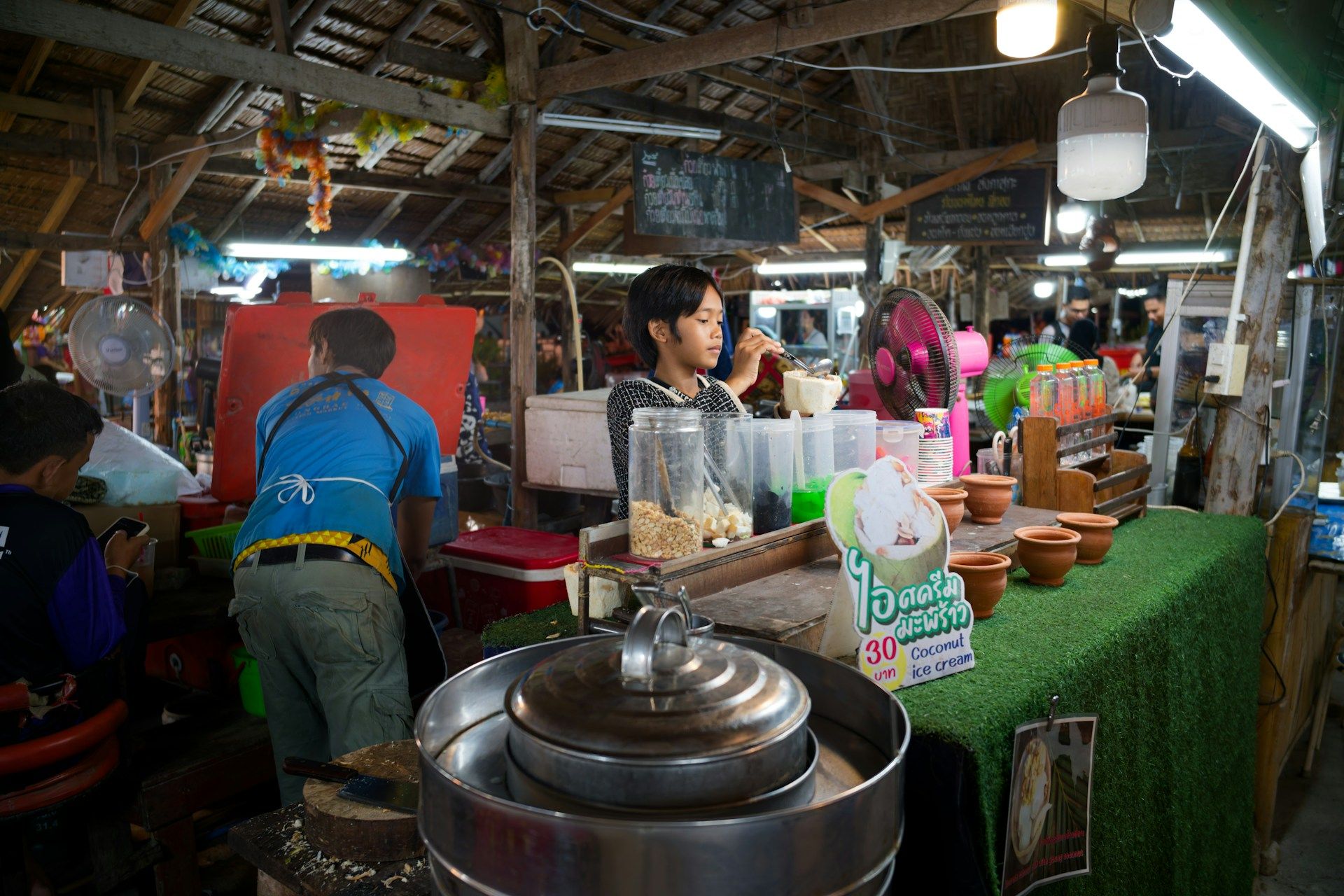 Street food vendor preparing coconut icecream