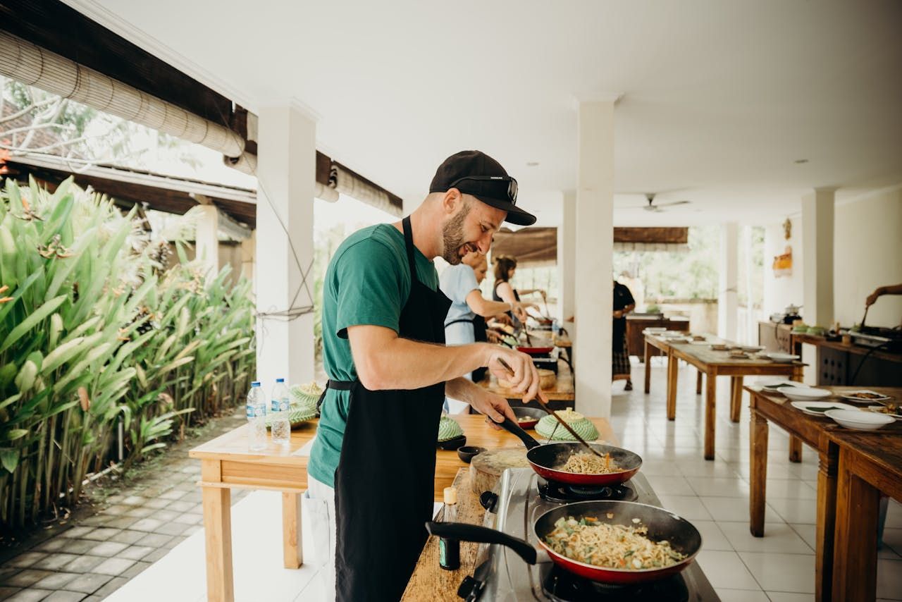 students using wok at a cooking class