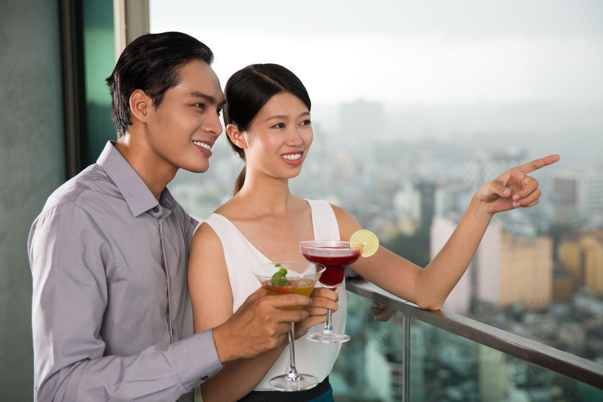 Couple is dating on roof top bar