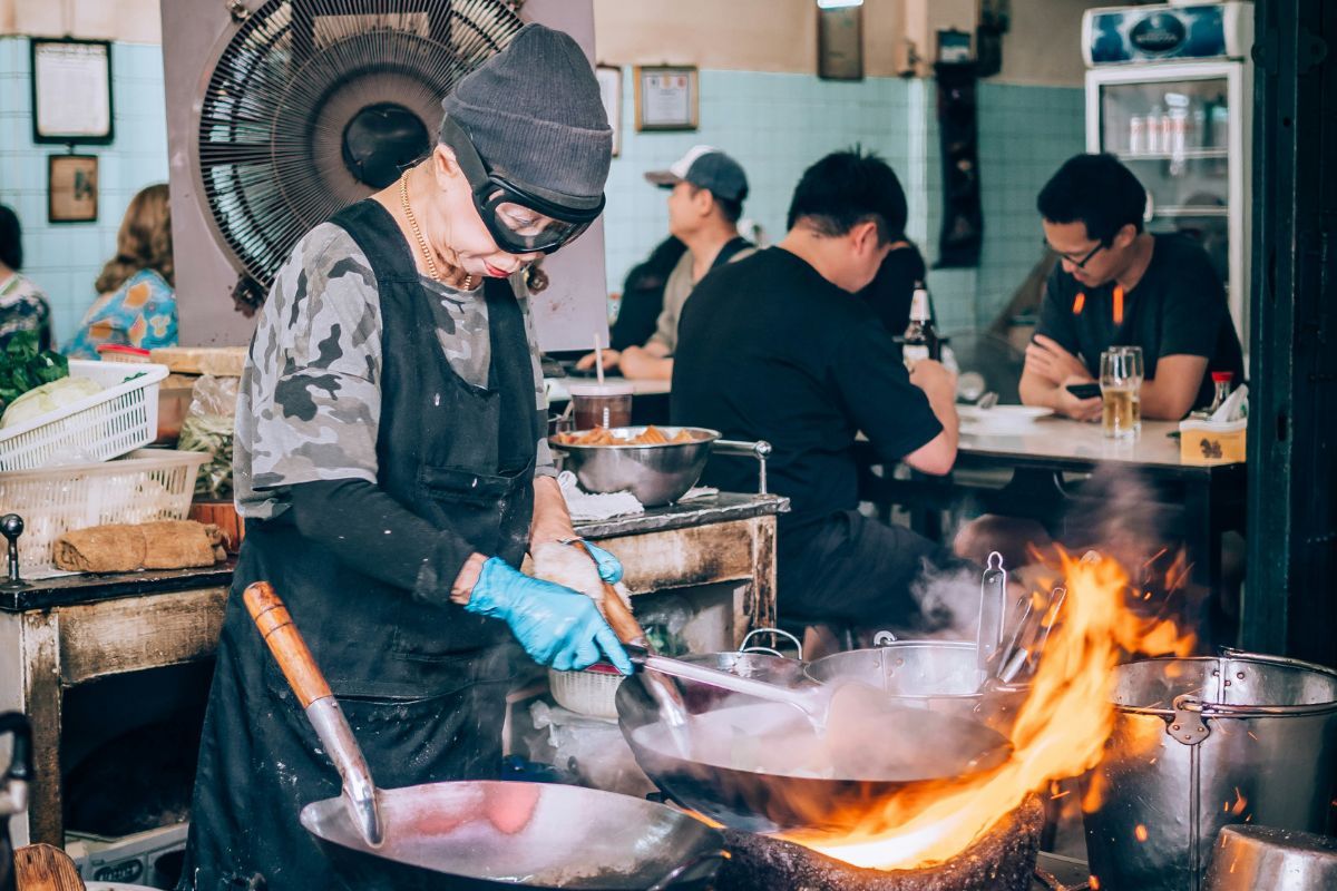Female cook is cooking