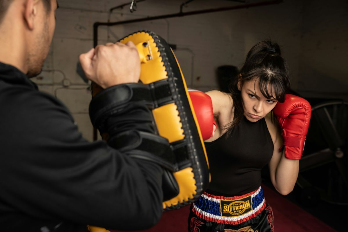 Woman is practicing Muay Thai